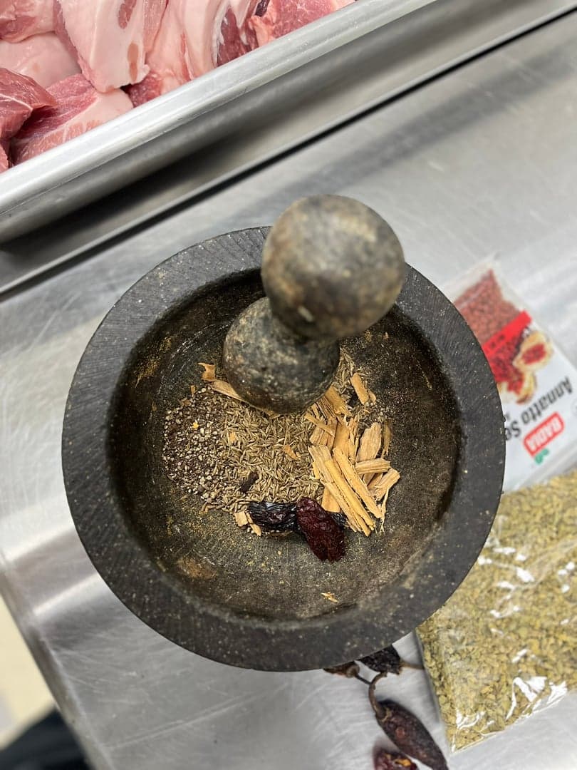 Stone molcajete over open fire